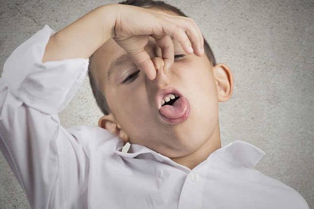 kid plugging his noise making a foul face 2