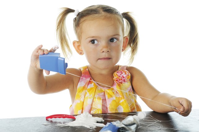 child playing with dental floss 2
